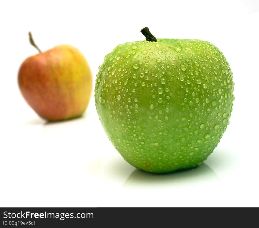 Red and green apple. Shallow DOF. Focus on a green apple. Red and green apple. Shallow DOF. Focus on a green apple.