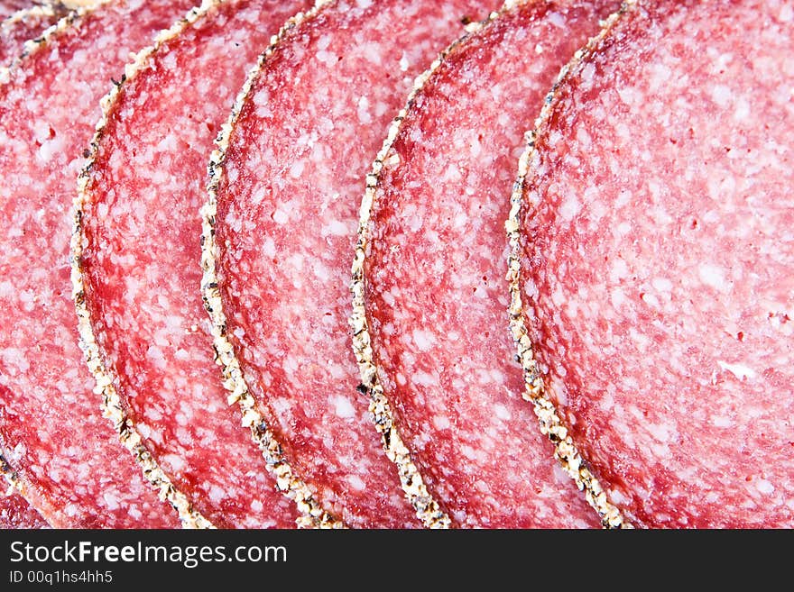 A close-up of peppered salami