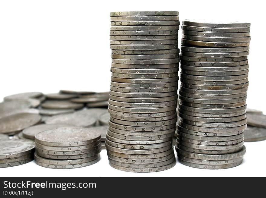 Piles of coins with white background. Piles of coins with white background