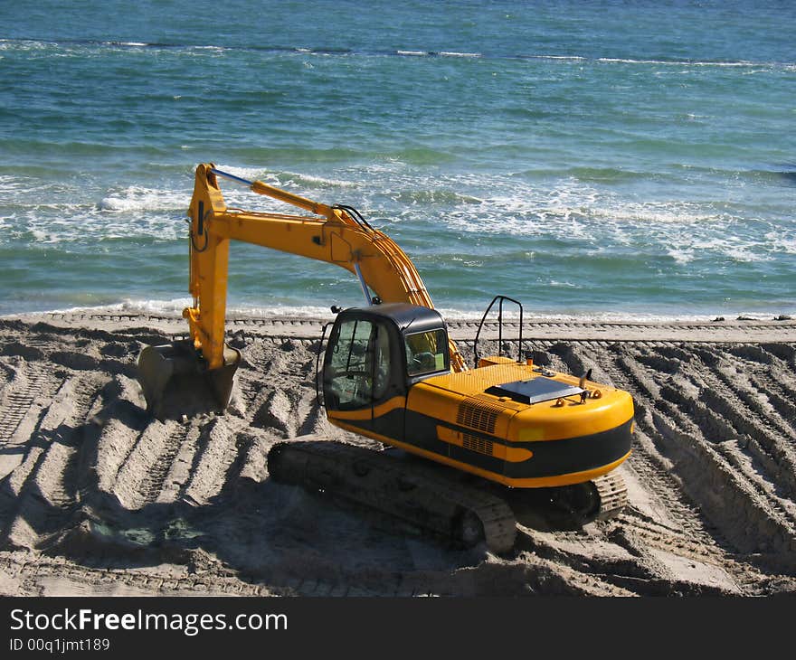 Excavator on the beach