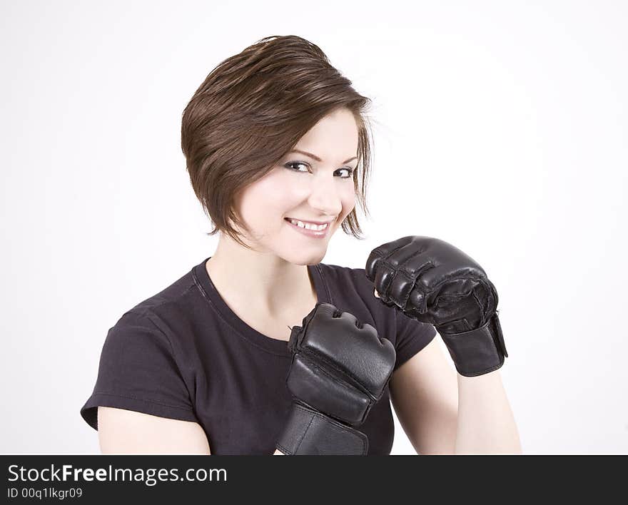 Brunette woman in boxing attire smiling at the camera. Brunette woman in boxing attire smiling at the camera.