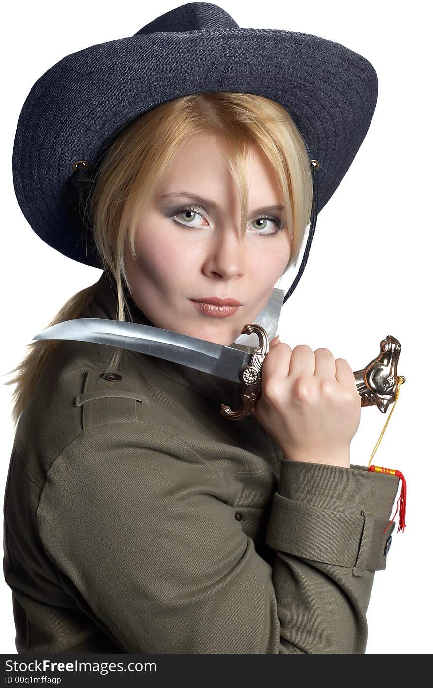 Scout girl wearing uniform, with sharp knife in her hand