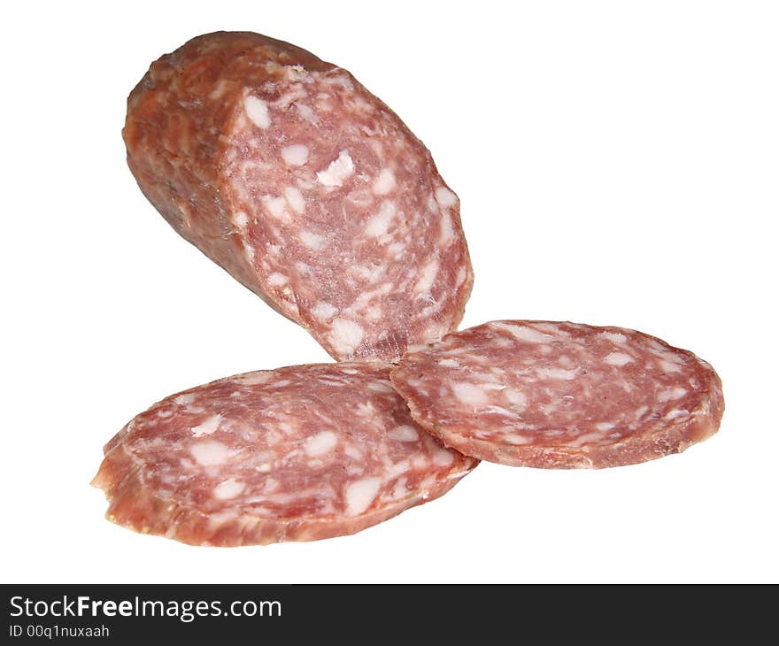 Hard salami and two slices isolated on white background