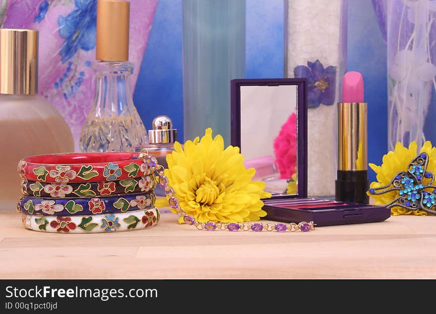 Jewelry and Cosmetics with Flowers on Vanity