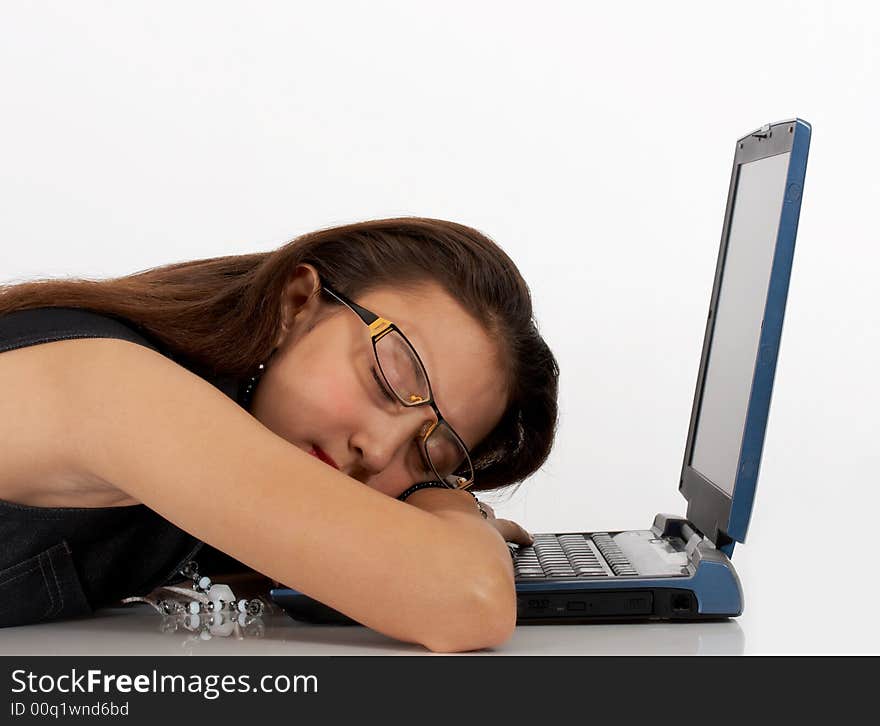 Secretary sleeping in front of her laptop