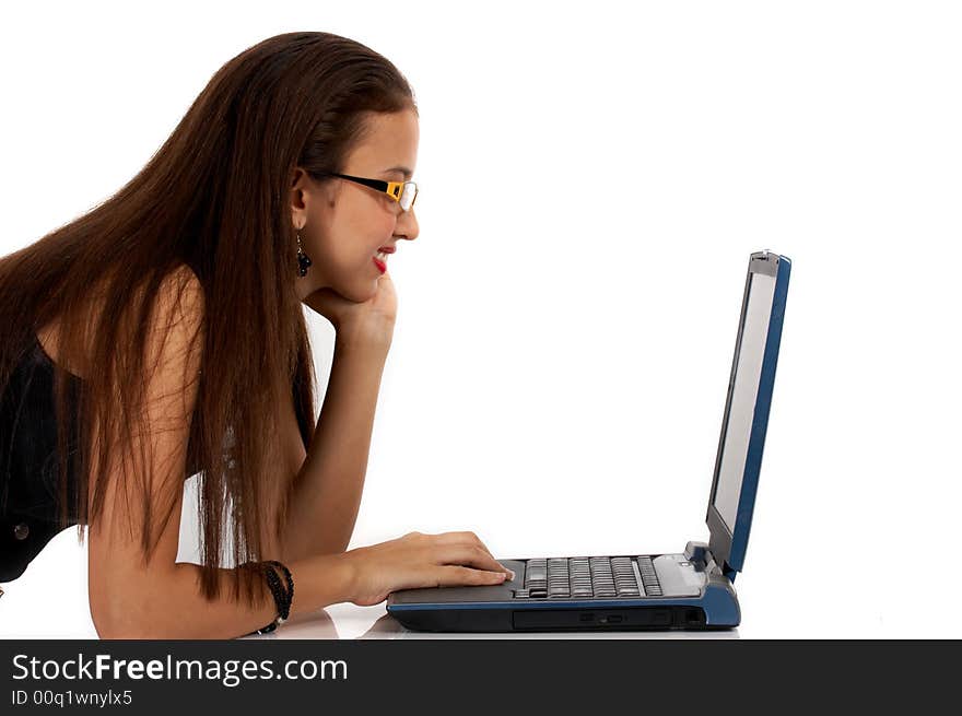 Young secretary working on her laptop - looking serious