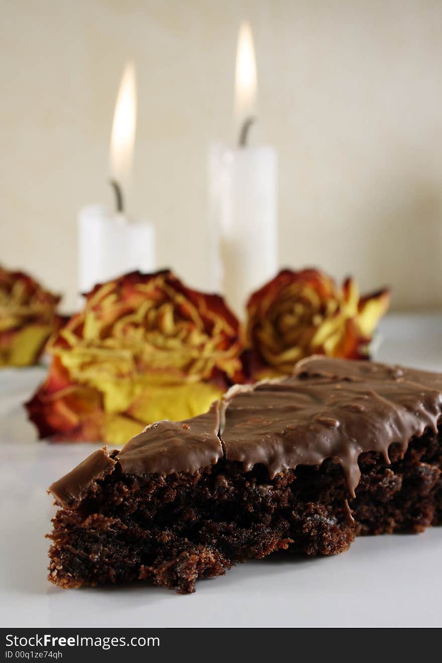 Chocolate cake with roses and candle light