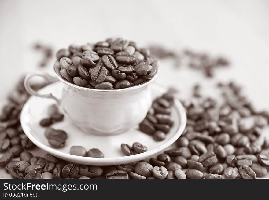 Still life of coffee grains and pieces of service