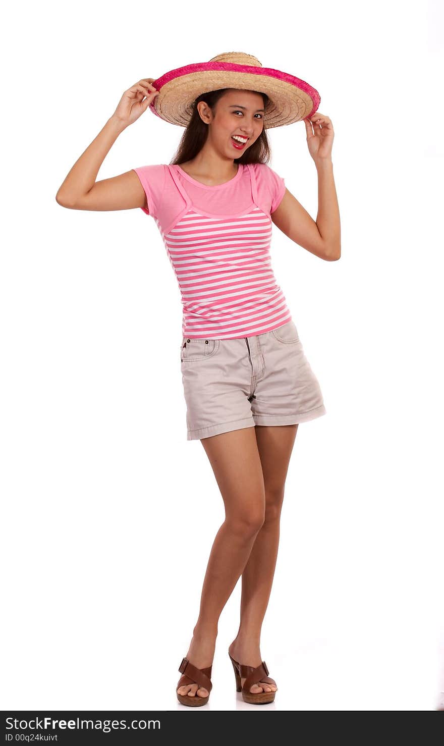 Gorgeous young female wearing a summer hat