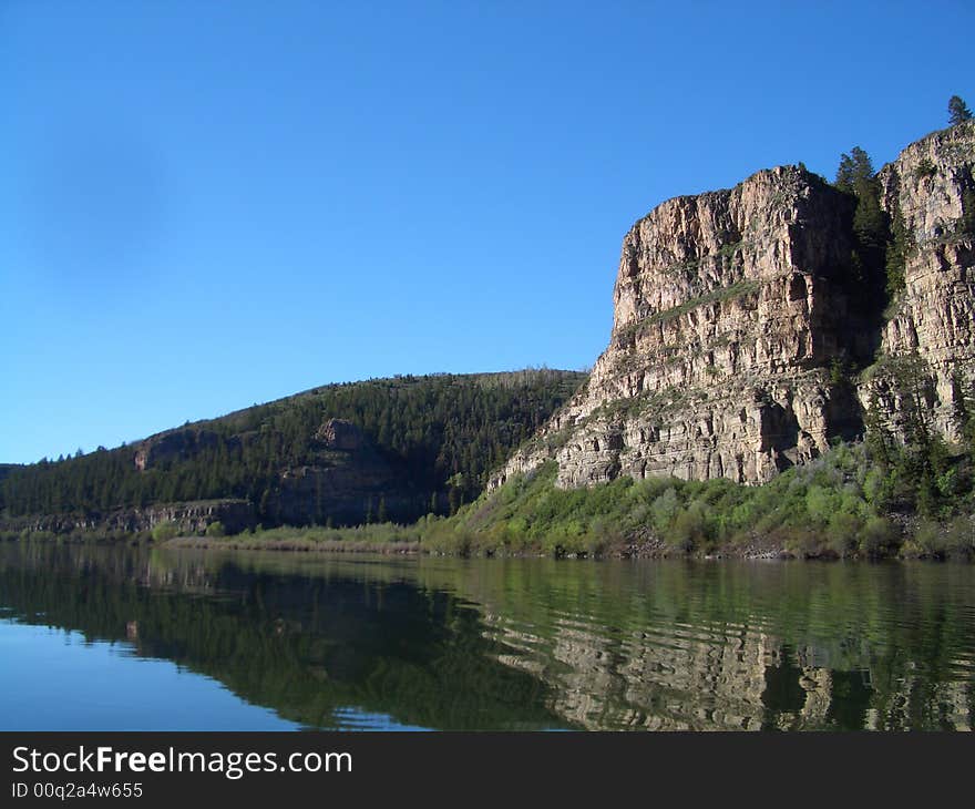 Small lake nestled amongst buttes and mountains in Colorado. Small lake nestled amongst buttes and mountains in Colorado