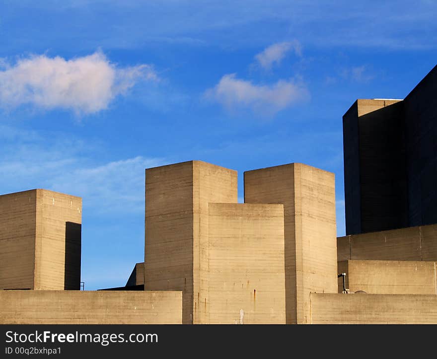 Contrast of the modern building of the Hayward Gallery against the sky, clouds and nature in London. Contrast of the modern building of the Hayward Gallery against the sky, clouds and nature in London