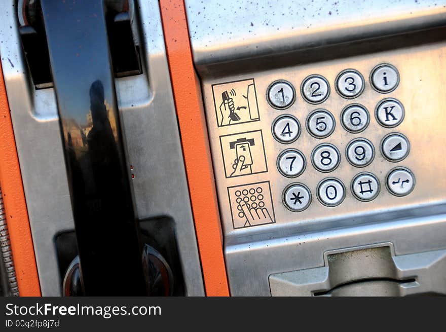 A view with a public phone close up