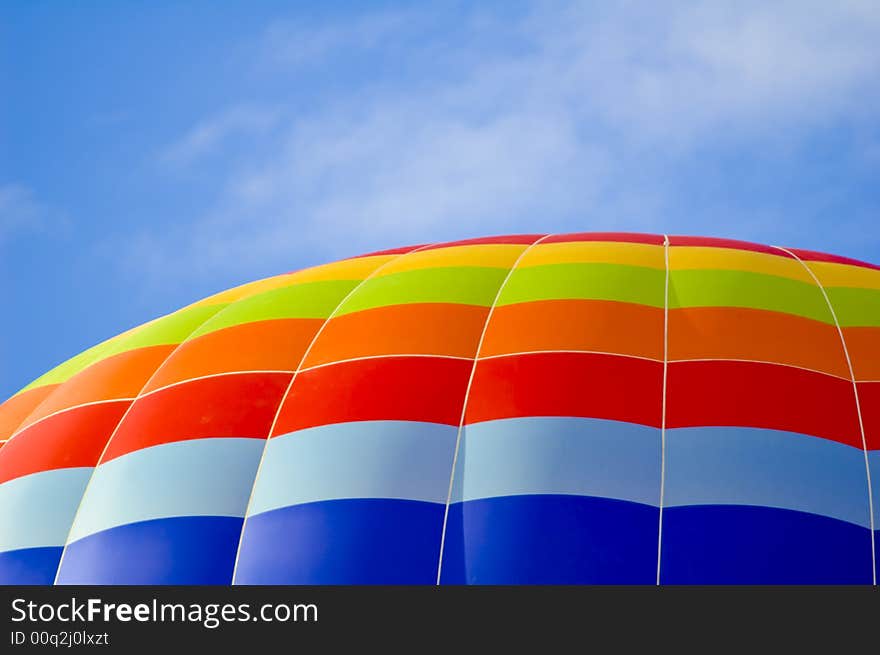 Hot air balloon on the blue sky