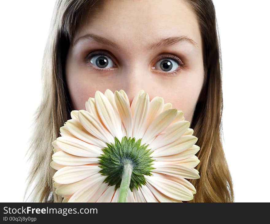 Surprised girl looking over flower