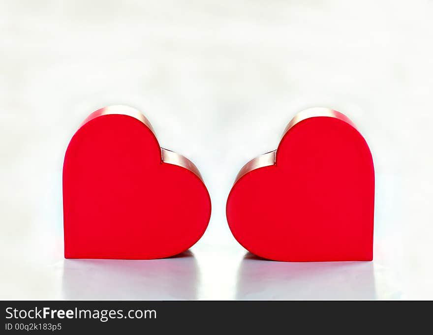 Two red heart over white background. Two red heart over white background