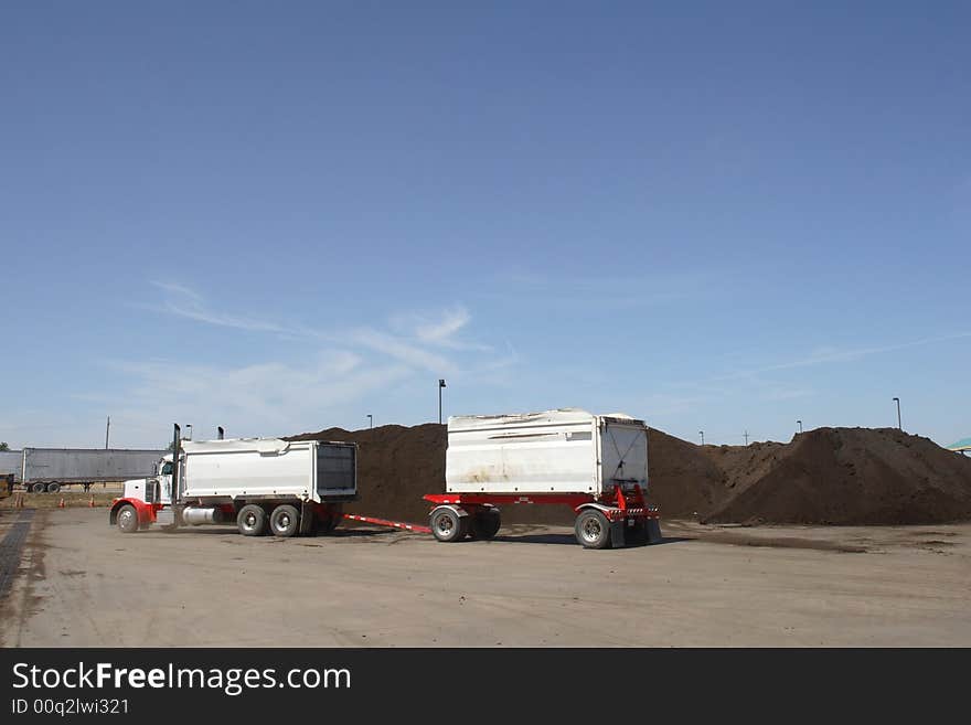 A truck pick up the final mulch product to be delivered to customers. A truck pick up the final mulch product to be delivered to customers