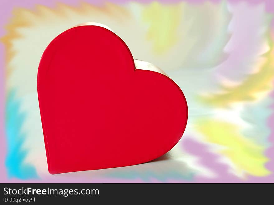 Red  heart box over colorful background. Red  heart box over colorful background