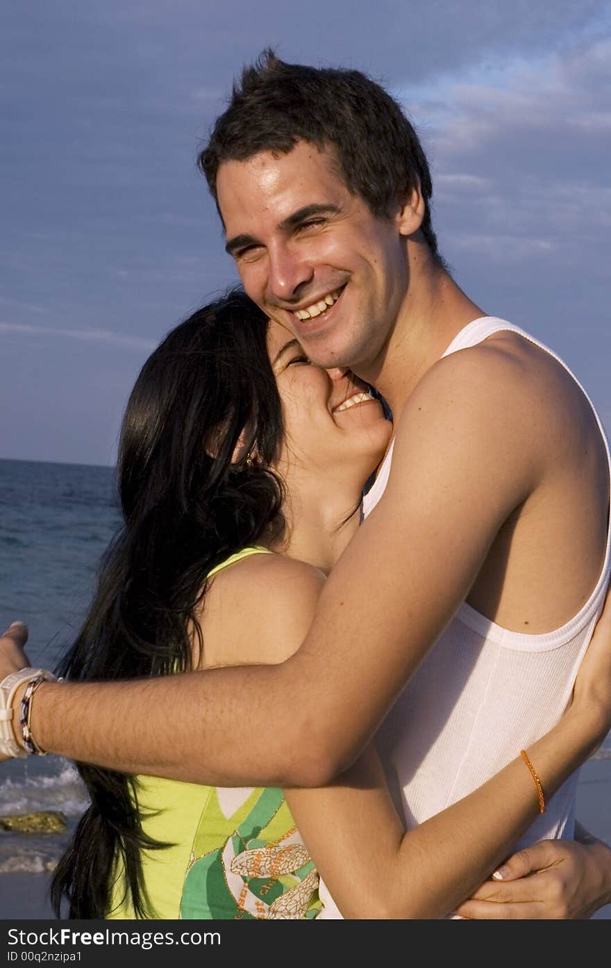 Teen couple having fun on the beach. Teen couple having fun on the beach