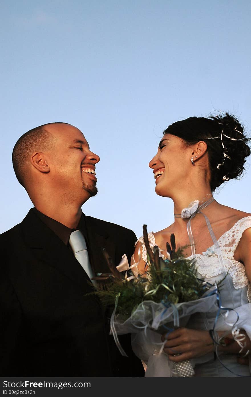 Young hispanic couple on wedding day outdoors - just married. Young hispanic couple on wedding day outdoors - just married