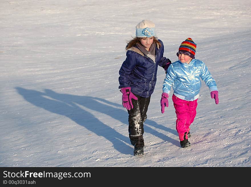 Several Children Sledding