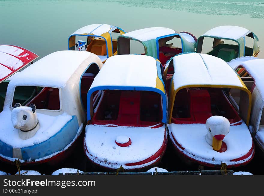 Boats are at anchor after snow