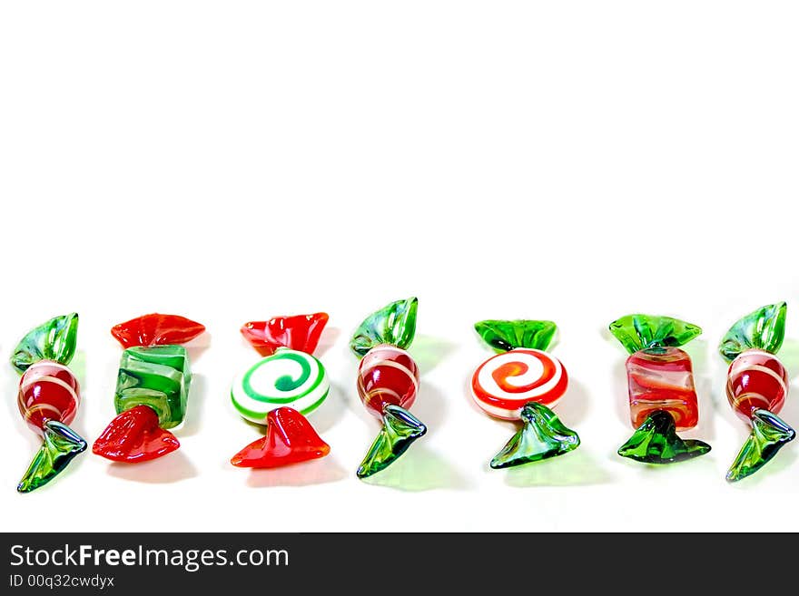 Here is a line of glass candies in red, green and white.