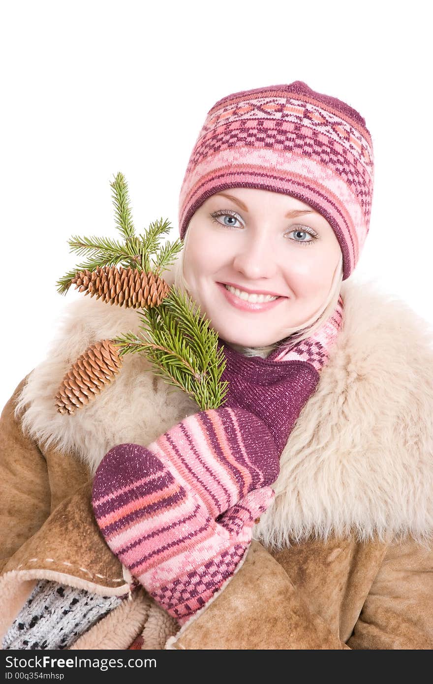 Young happy woman with a branch of fur tree with cones. Young happy woman with a branch of fur tree with cones