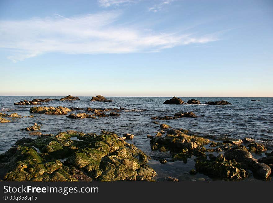 Rocks forming little islands near the beach