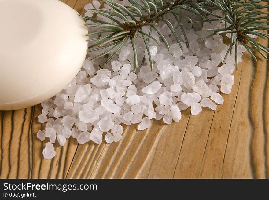 Pine bath items. sea salt with fresh branch on the old wood. Pine bath items. sea salt with fresh branch on the old wood