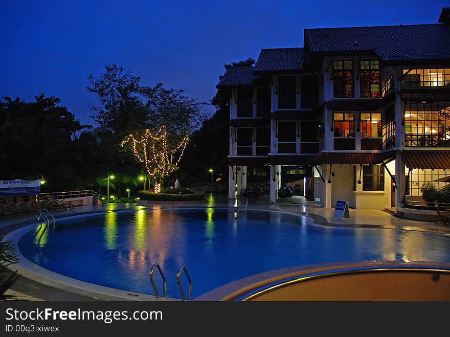 Night scene of hotel and swimming pool