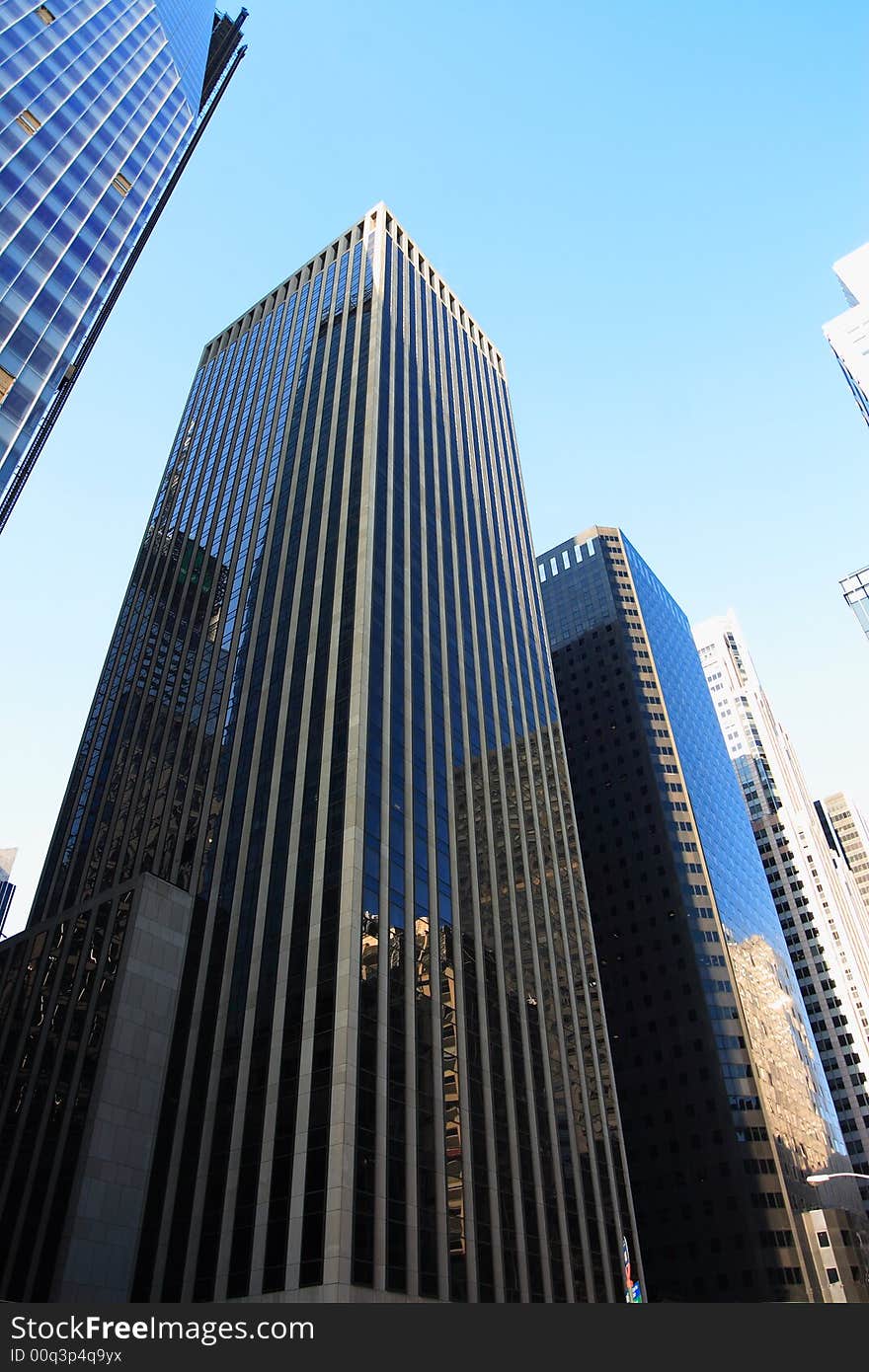 Reflective corporate buildings on a clear day in manhattan. Reflective corporate buildings on a clear day in manhattan