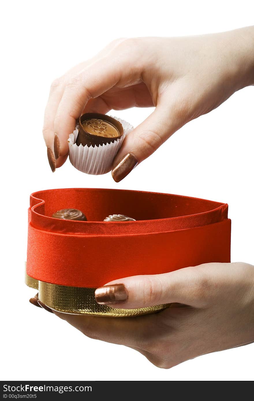 Woman hands holding box and chocolate candy