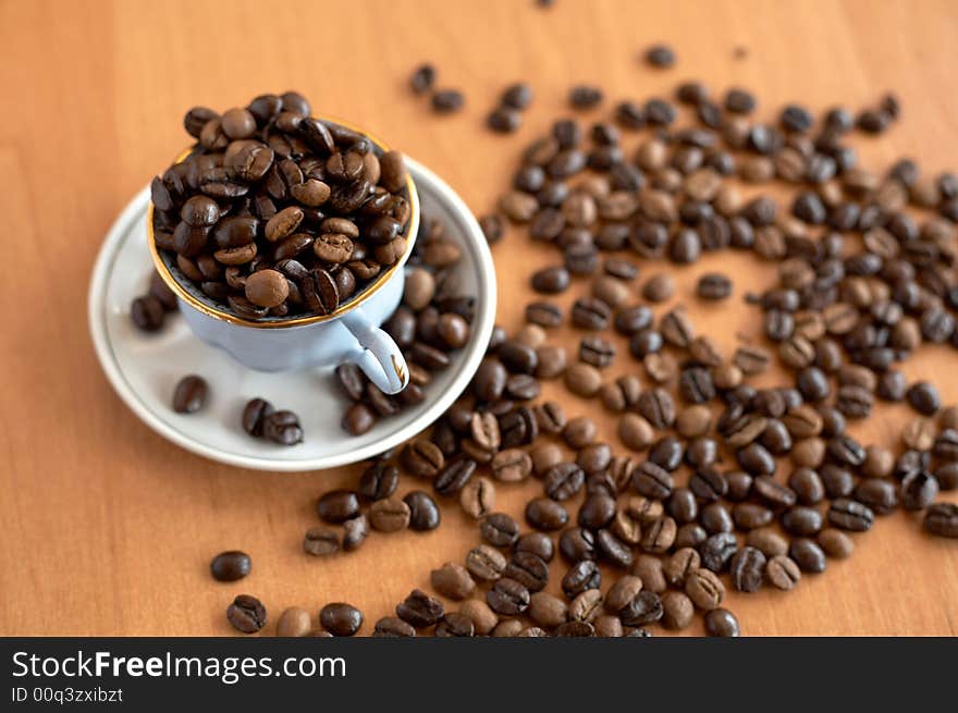 Still life of coffee grains and pieces of service. Still life of coffee grains and pieces of service