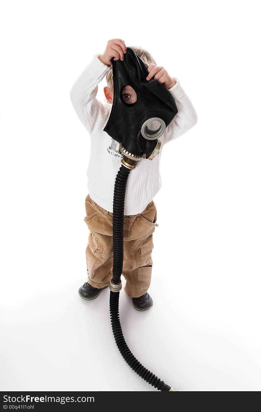 The kid and a gas mask. On a white background