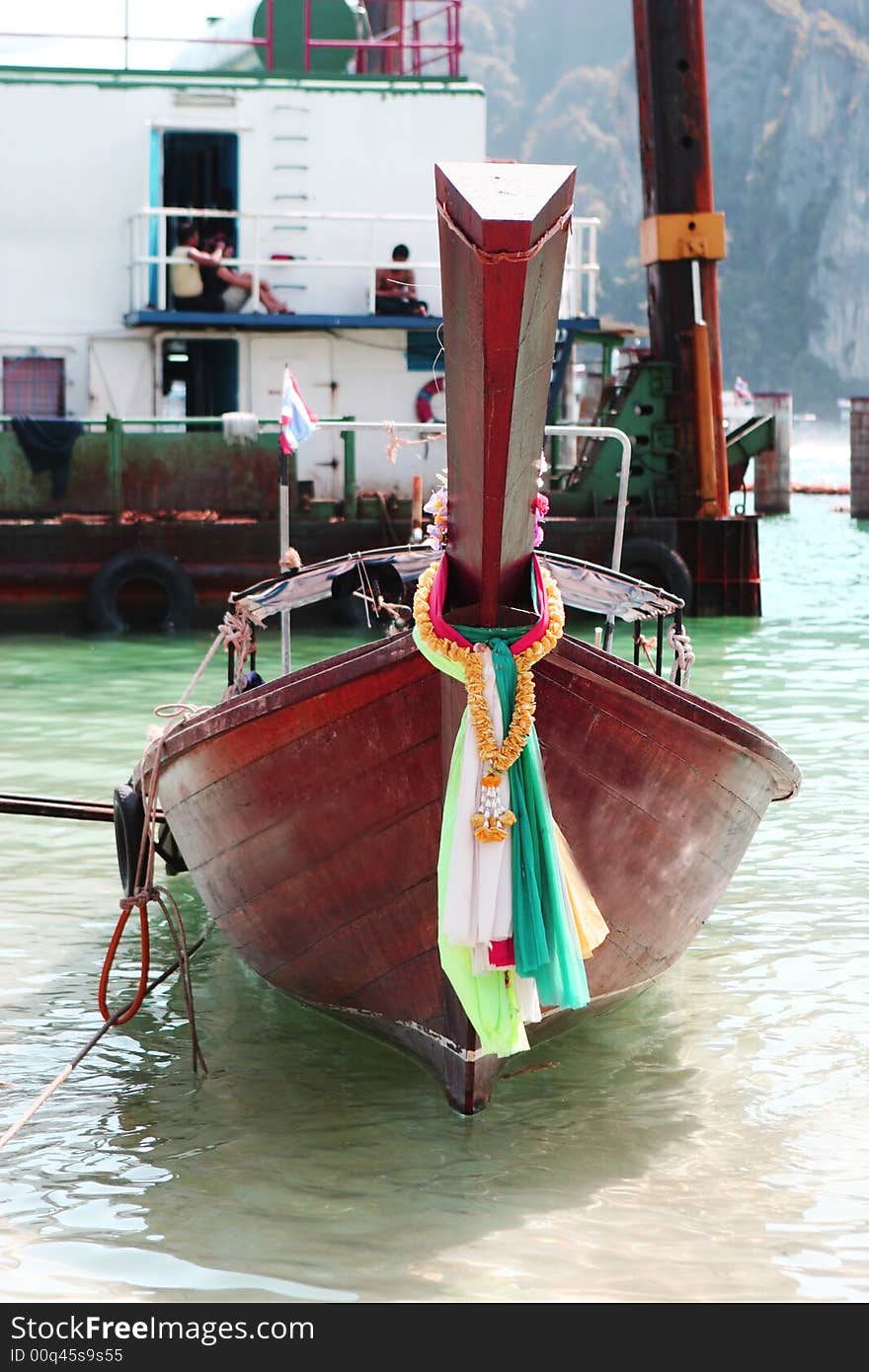 Long tail boat at Phi Phi Island, Thailand - travel and tourism. Long tail boat at Phi Phi Island, Thailand - travel and tourism.