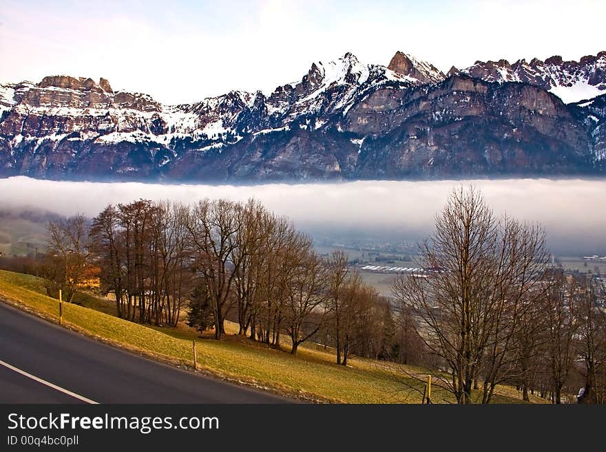 Winter landscape mountains in the fog. Winter landscape mountains in the fog