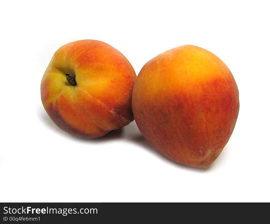 Two peaches isolated on a white background