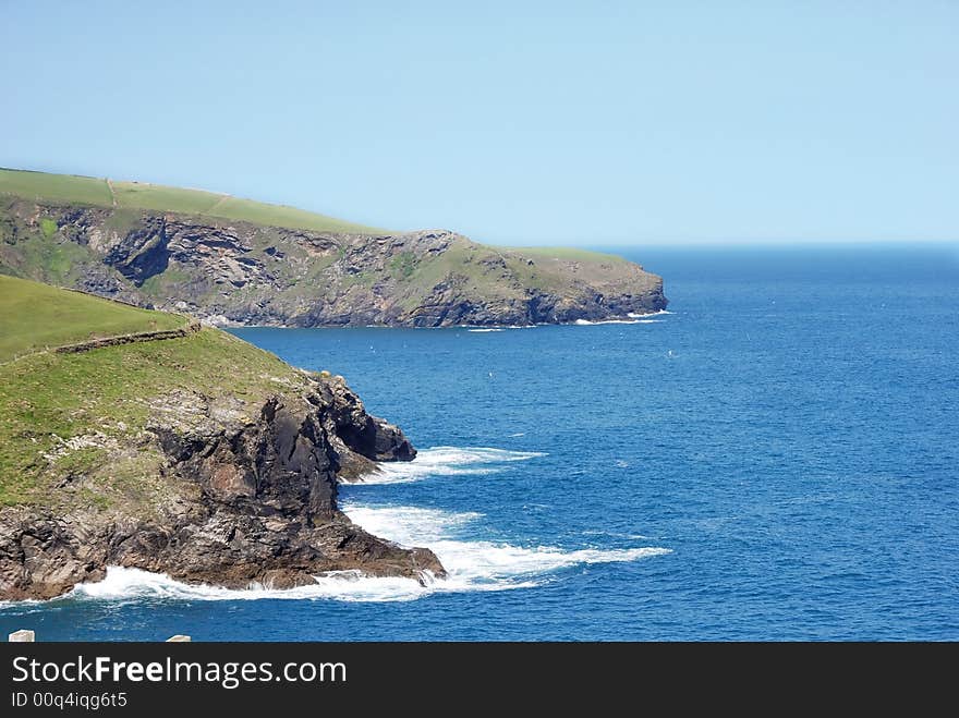 Green hills by the ocean