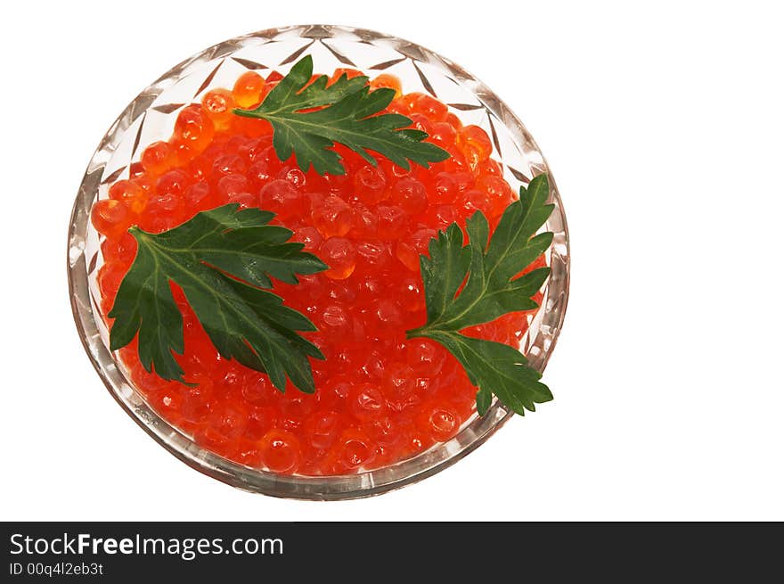 Crystal dish with red caviar on a white background