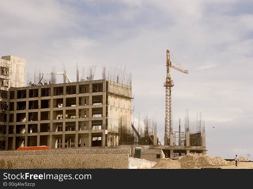 A beachfront condo construction project of steel and concrete. A beachfront condo construction project of steel and concrete