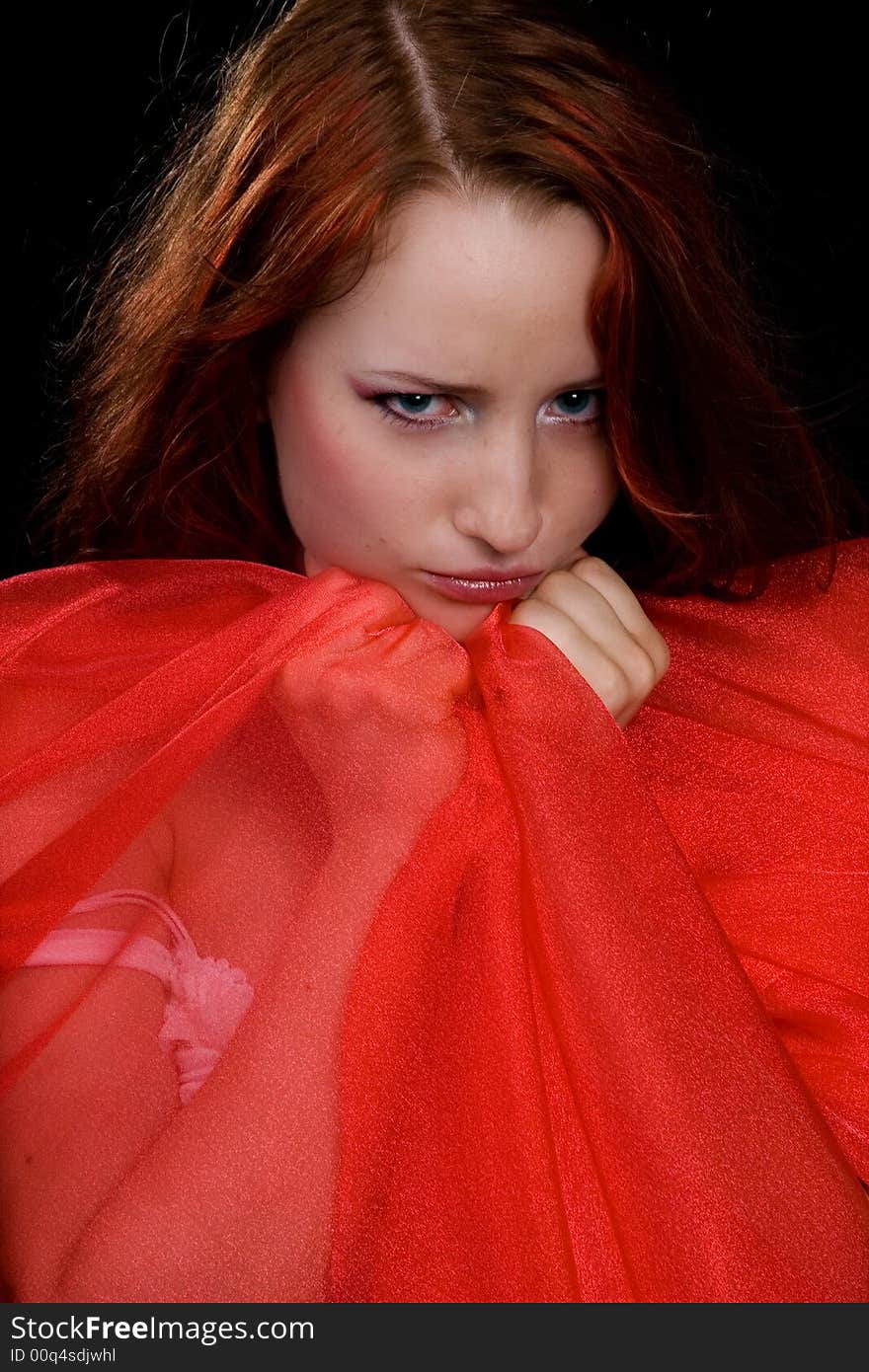 The girl with a red scarf on a black background