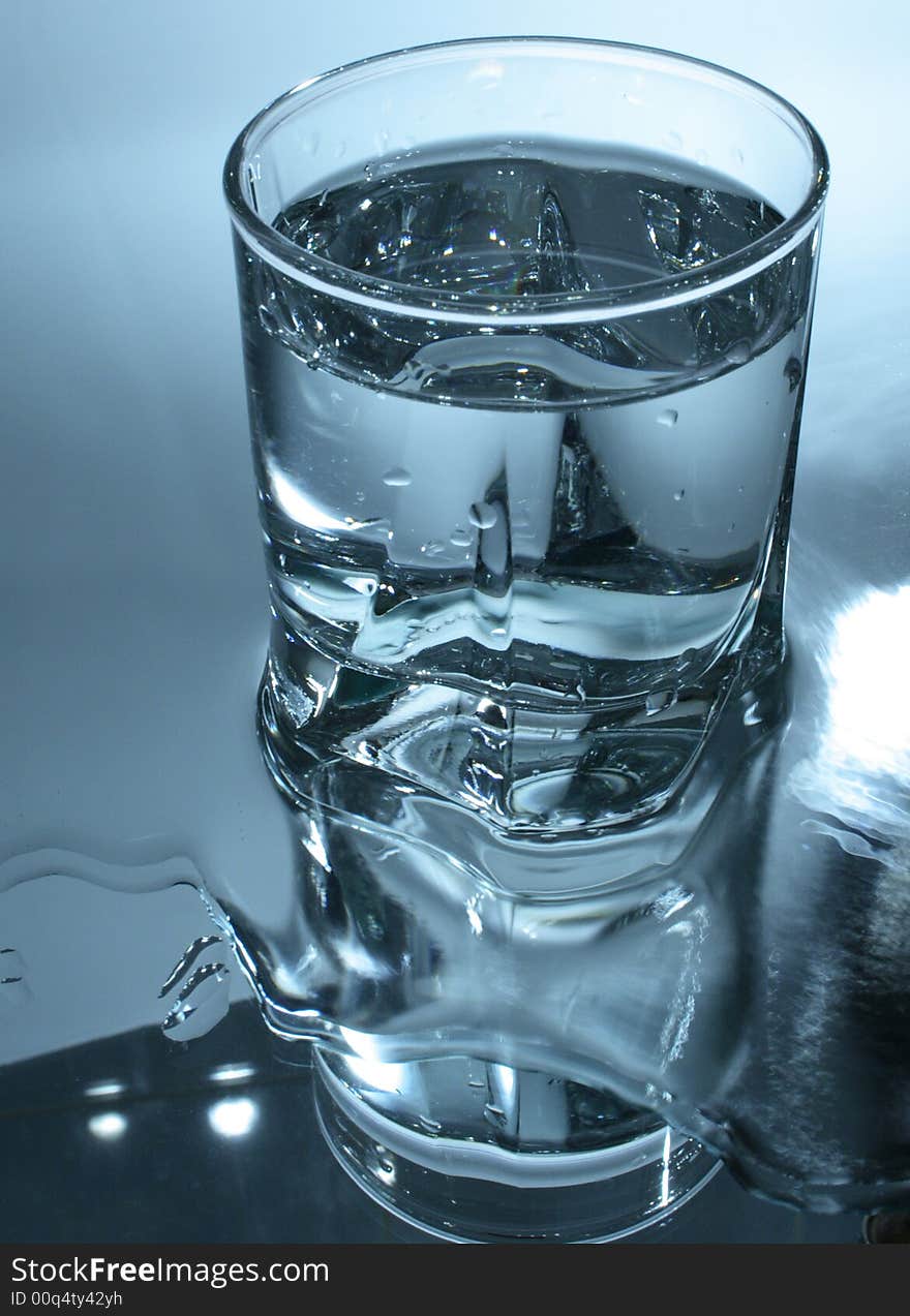 Glass of water in dark-blue