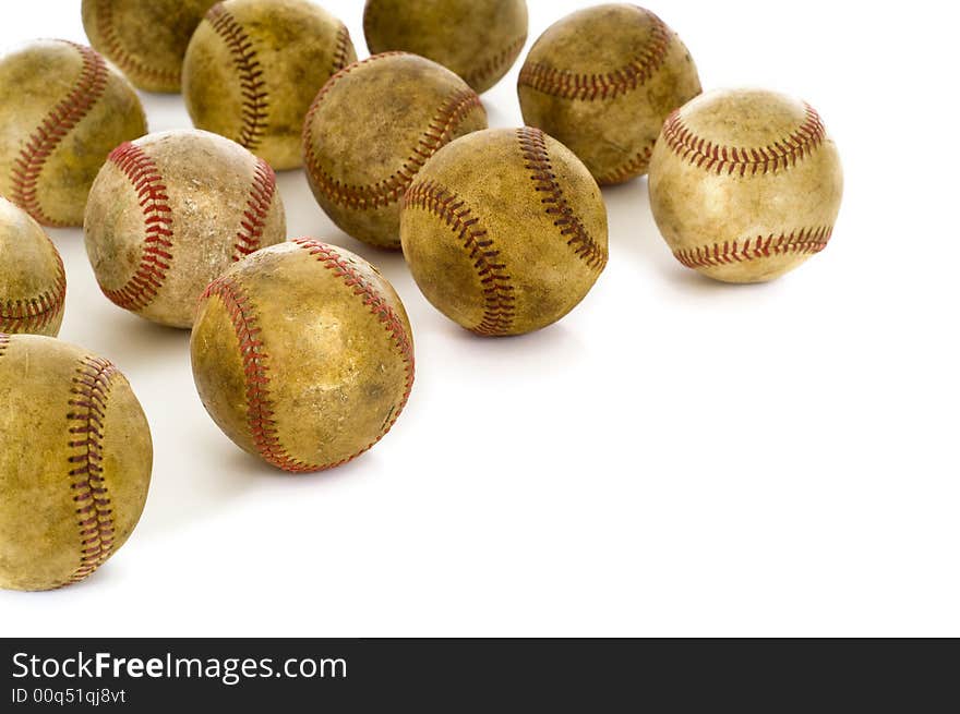 A background of vintage, antique, old baseballs on a white background with copy space. A background of vintage, antique, old baseballs on a white background with copy space