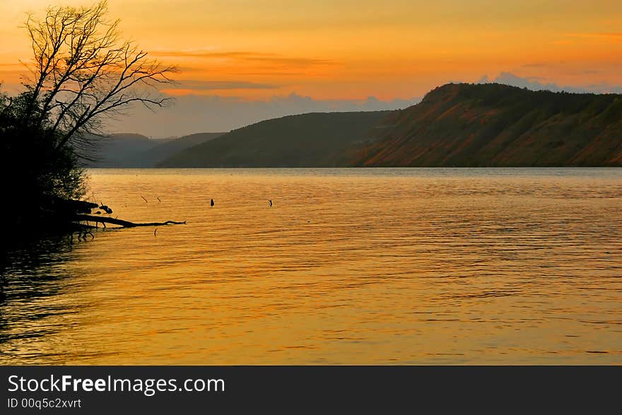 The river painted in orange color sunset