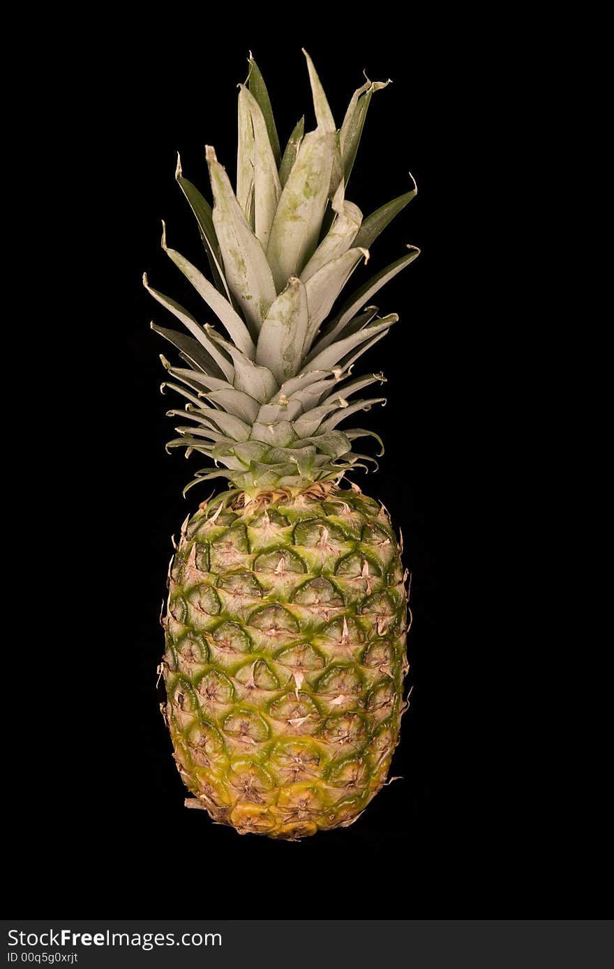 Ripe pineapple isolated on black background. Ripe pineapple isolated on black background