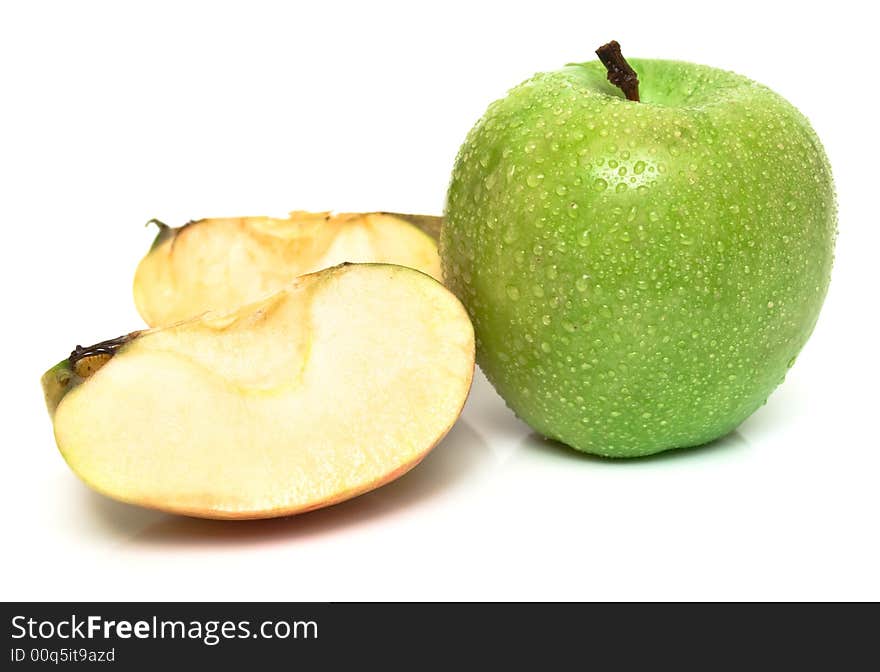 The whole green and parts of red apple on white. Isolation on white. Shallow DOF. The whole green and parts of red apple on white. Isolation on white. Shallow DOF.