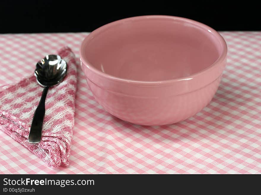 A picnic table set for lunch in pink