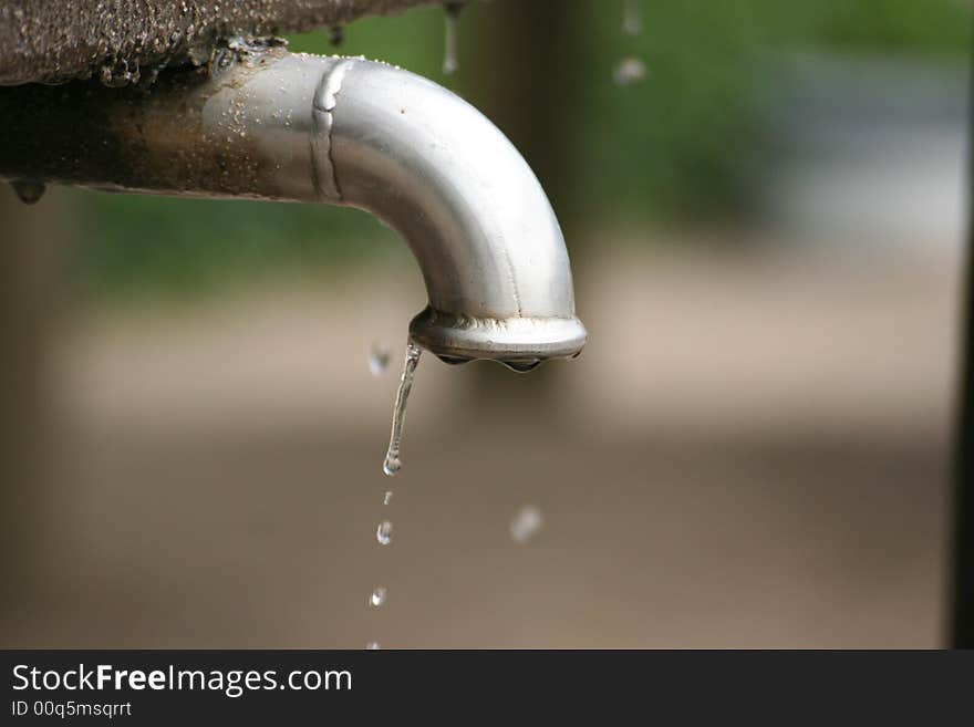 In a park i found this dripping crane and made a photo of it