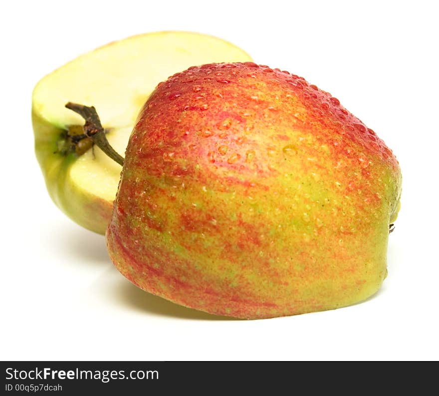 Two half one red apples covered by water drops. Isolation on white. Shallow DOF. Two half one red apples covered by water drops. Isolation on white. Shallow DOF.