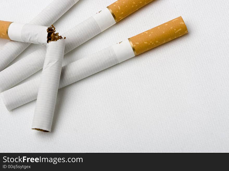 Four cigarets on white backgrounds